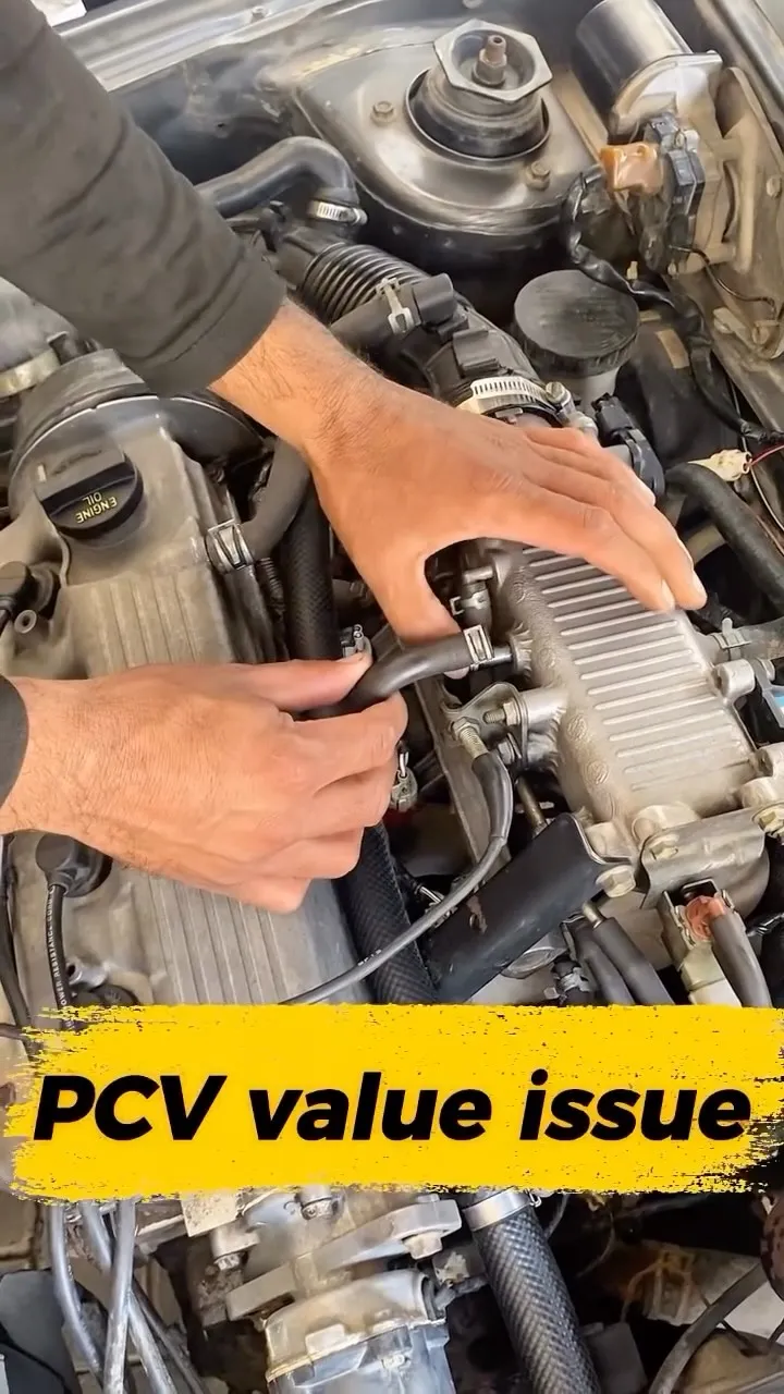 Mechanic checking the PCV valve on a Suzuki Cultus engine